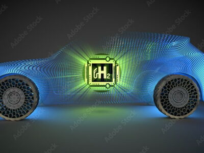 Ein digitales Modell eines Wasserstoffautos zeigt ein leuchtendes H2-Symbol in der Mitte des Fahrzeugs.